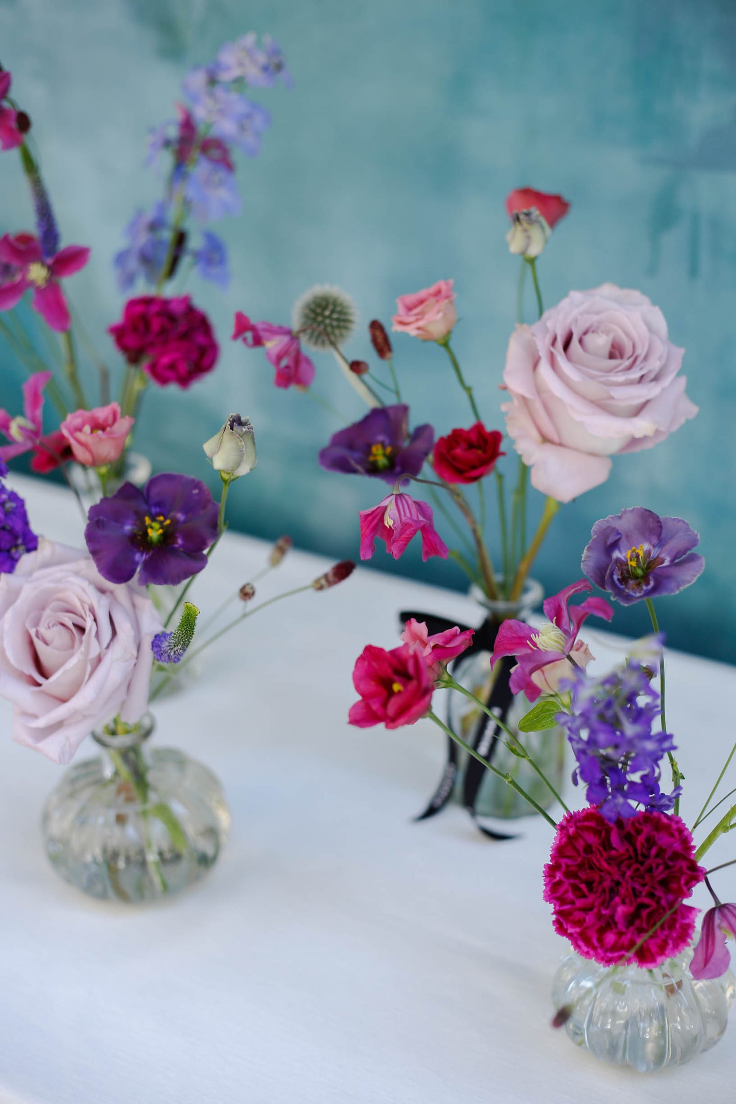 Set de 4 botellitas con flores de temporada