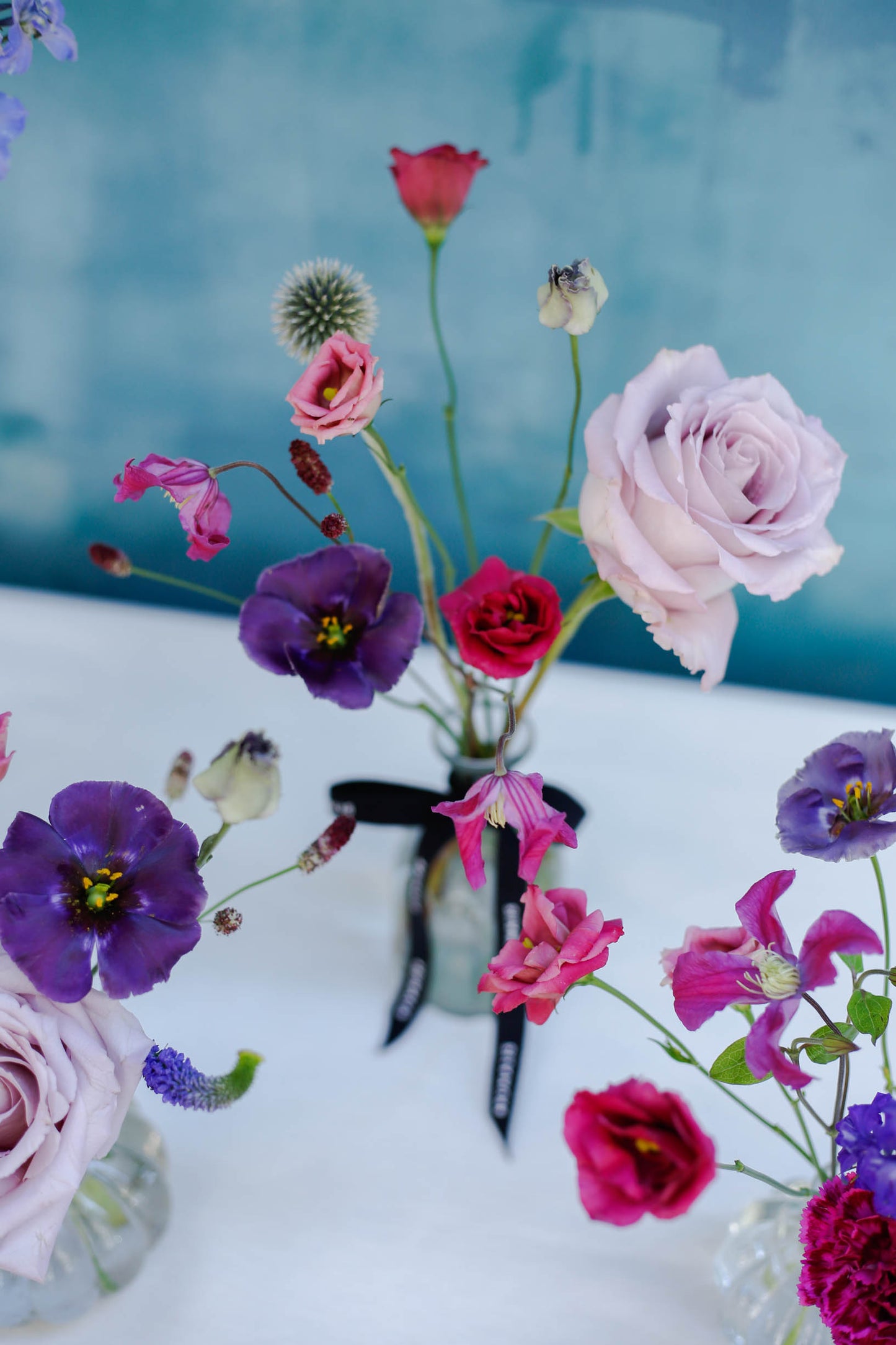 Set de 4 botellitas con flores de temporada