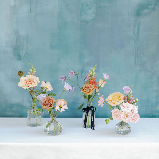 Set de 4 botellitas con flores de temporada
