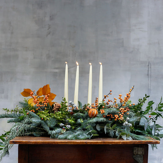 Centro de mesa de Navidad con naranjas